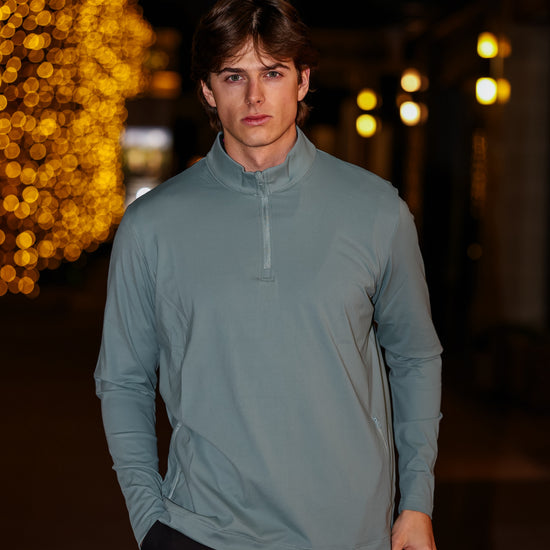 Man Wearing Green Q Zip